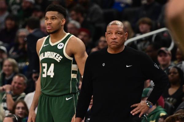 Milwaukee Bucks head coach Doc Rivers and forward Giannis Antetokounmpo (34) during the fourth quarter against the Memphis Grizzlies at Fiserv Forum on April 3, 2024. 