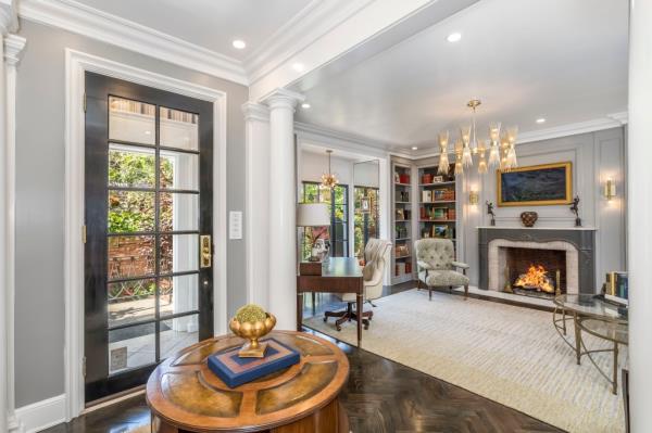 A view of the layout, whose original touches include a fireplace.