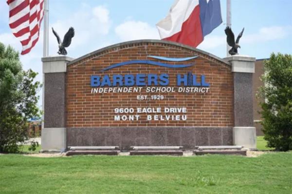 A newspaper ad featuring Barbers Hill Independent School District, with text defending the suspension of a Black student for wearing dreadlocks.