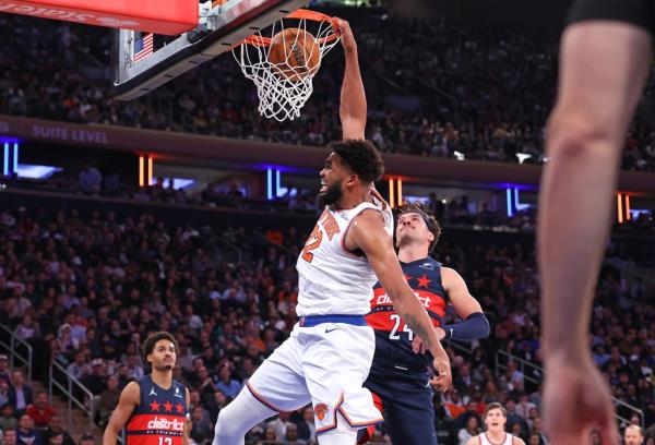 Karl-Anthony Towns #32 of the New York Knicks slams the ball during the first half.