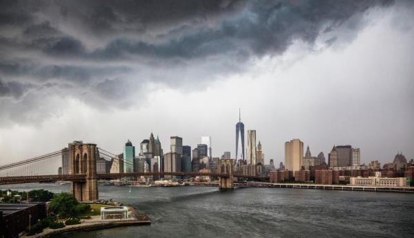 Thunderstorms loom over Manhattan skyline.