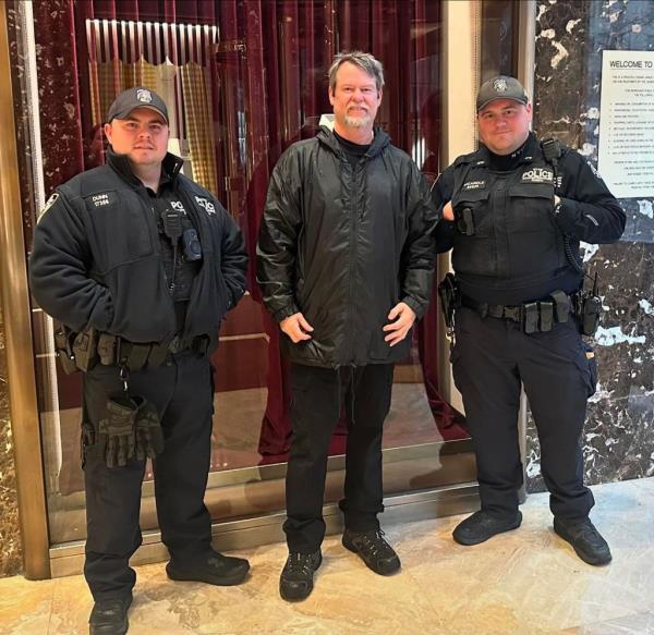 Flash Shelton posing for a photo with police.