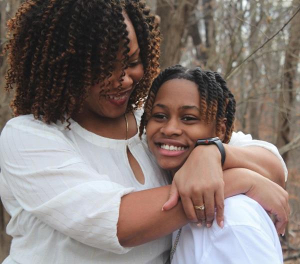 Naima Liggon hugged by her mother