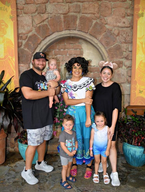 Haley Sisk, her husband Austin, and their three children Everly, Ryder, and Ella posing at Disney World in Orlando, Florida, August 2024