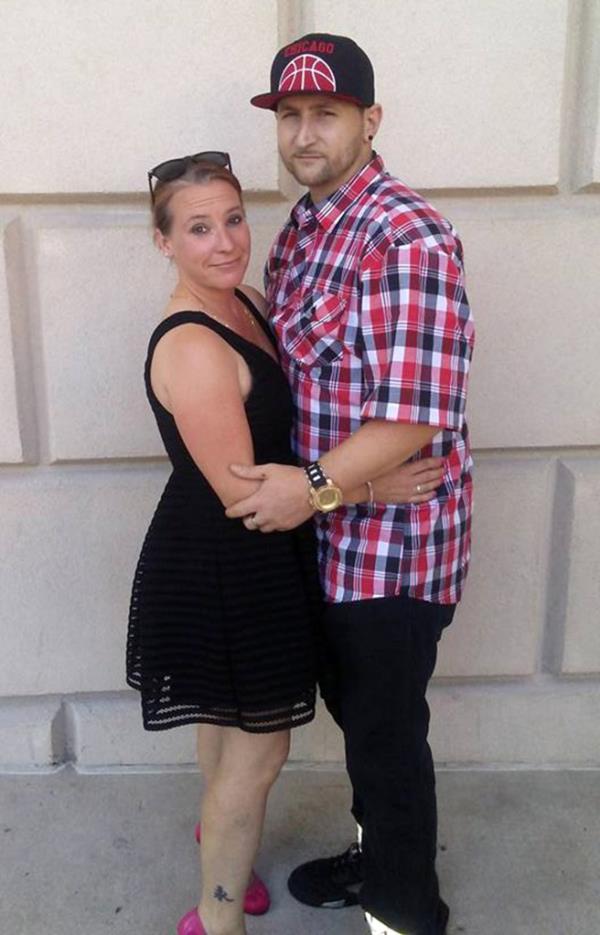 man and woman posing for a picture