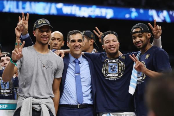 Former Villanova player Josh Hart of celebrates with head coach Jay Wright, Jalen Brunson and Phil Booth after defeating the Michigan Wolverines during the 2018 NCAA Men's Final Four Natio<em></em>nal Champio<em></em>nship game.