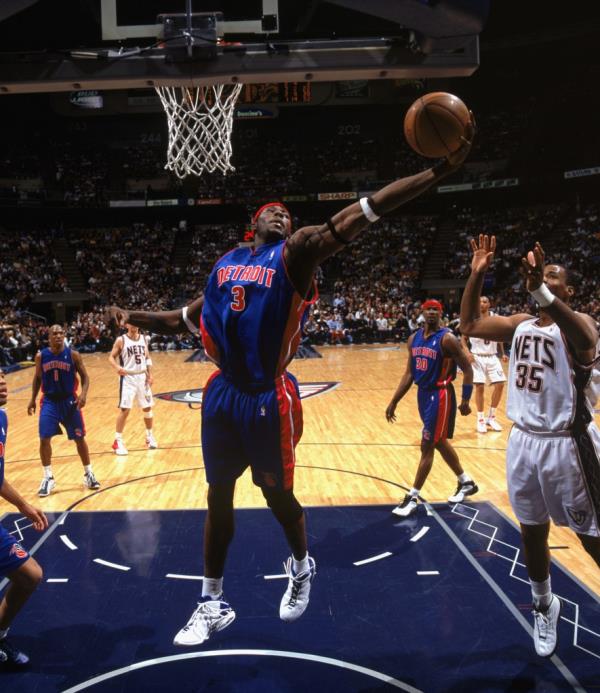 Ben Wallace of the Pistons rebounds against the New Jersey Nets in Game Four of the Eastern Co<em></em>nference Finals during the 2003 NBA Playoffs.