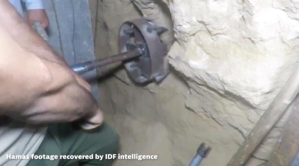 Hamas operatives use a drill to create long shafts inside one of the underground rooms. 