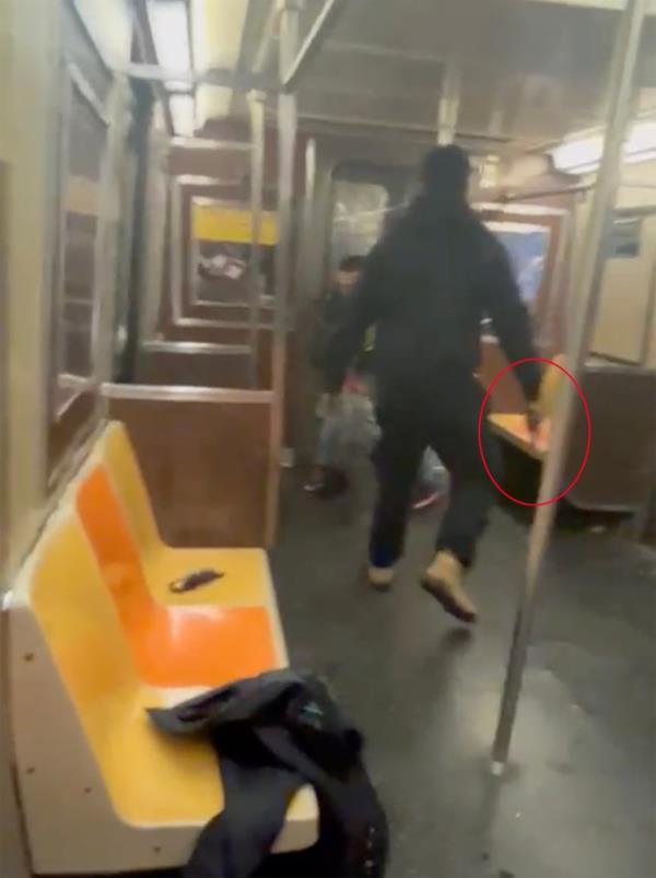 The perpetrator is seen holding a gun.