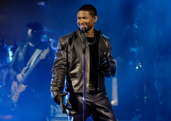 Photo of Usher in a leather outfit.