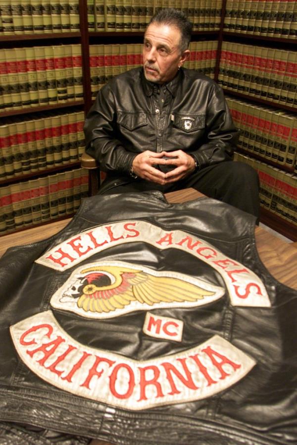 Hells Angels president George Christie Jr sits with the vest he was wearing when he was denied entry into the Ventura County Fair because of their biker attire earlier this year. The motorcycle club has filed a legal claim Tuesday claiming fair organizers violated their civil right.  (Photo by Bryan Chan/Los Angeles Times via Getty Images)