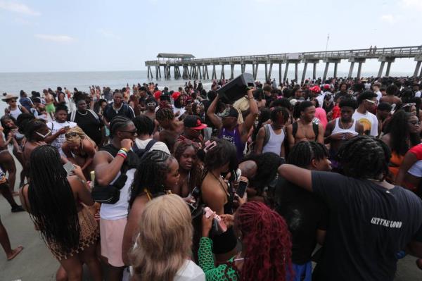 Spring breakers gathe rduring Orange Crush on Tybee Island, on April 20, 2024.