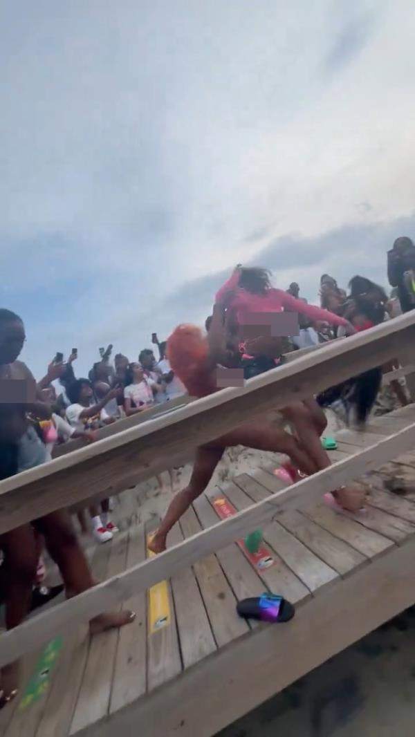 Two women were caught on video duking it out on the beach over the weekend