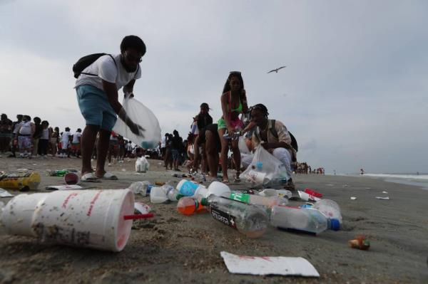 Tybee Island officials say there was enough trash left on the beach Saturday to fill more than 10 all-terrain vehicle carts.