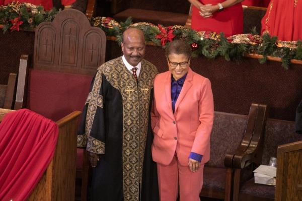Mayor Karen Bass standing with Reverend J Edgar Boyd at First African Methodist Episcopal Church in Los Angeles after giving a speech on homelessness crisis