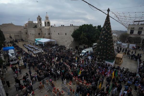 Latin Patriarch Pierbattista Pizzaballa greets a crowd of worshippers in Manger Square, adjacent to the Church of the Nativity, in 2022. The procession will be scaled back this year.