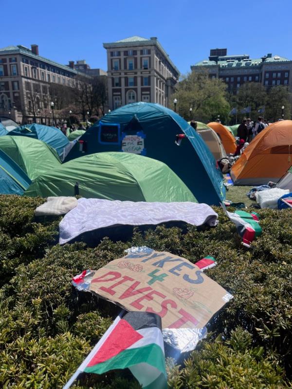 Tents with a sign in the foreground saying 