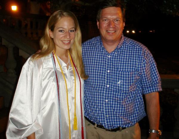 In this handout photo provided by Beth Twitty, Natalee Holloway, 18, left stands with her father Dave Holloway on her graduation day from Mountain Brook High School in Mountain Brook, Alabama, Tuesday, May 24, 2005.  Holloway disappeared while on a graduation trip to Aruba on May 30.