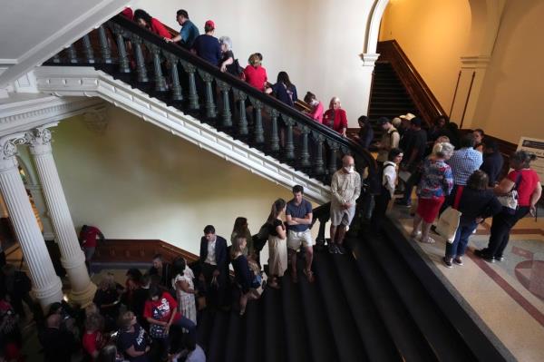 Members of the public lined up to attend the trial in the Senate gallery.