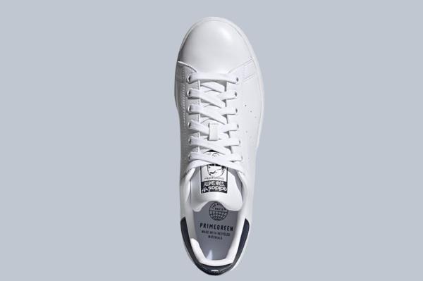 White sneaker with a logo on it