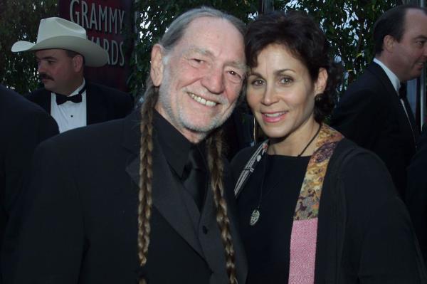 Willie Nelson smiling with his wife, Annie. 