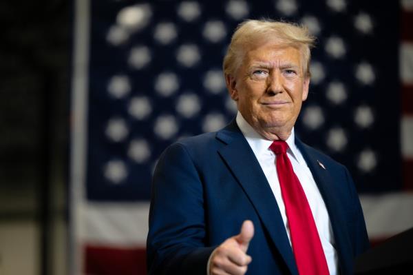 Former U.S. President Do<em></em>nald Trump, the Republican presidential nominee, giving a thumbs up as he arrives for a campaign rally at the Mosack Group warehouse in Mint Hill, North Carolina