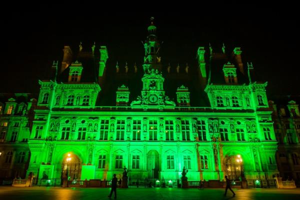 The Paris City Hall is illuminated in green to mark the disapproval of the French capital over Trump's decision to withdraw from the Paris Climate Agreement on June 1, 2017.