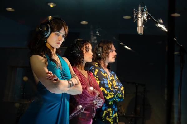 Three actors recording a song