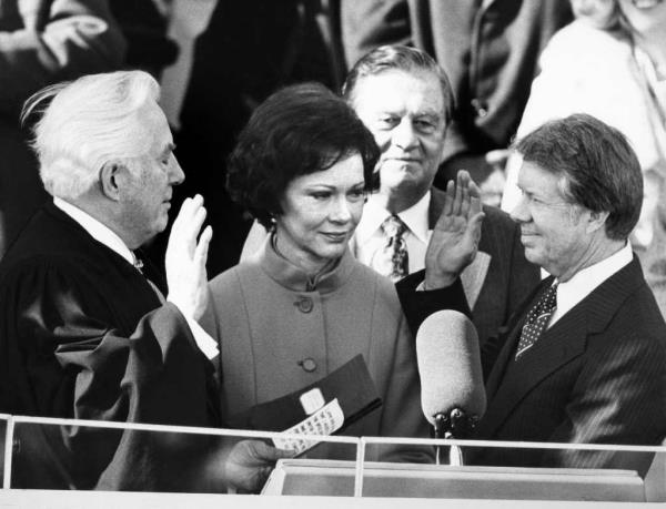 Rosalynn watching as Jimmy Carter takes the oath of office at his inauguration on January 20, 1977.