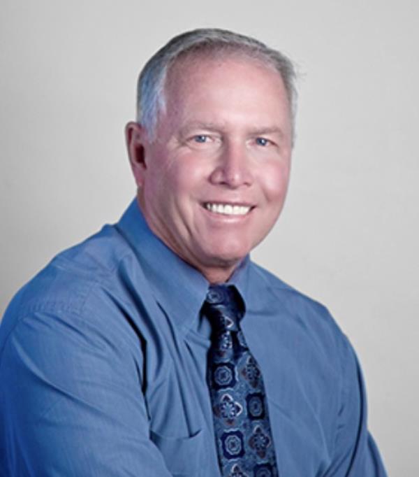 Don Hankey, a California-ba<em></em>sed billio<em></em>naire and owner of Knight Insurance, wearing a blue shirt and tie, known for underwriting Trump's $175M bond
