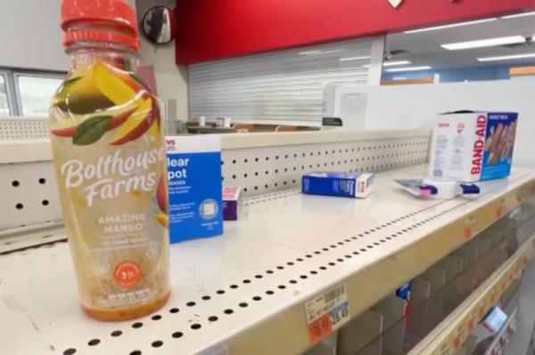 Nearly bare shelves at Washington, DC, CVS outlet.