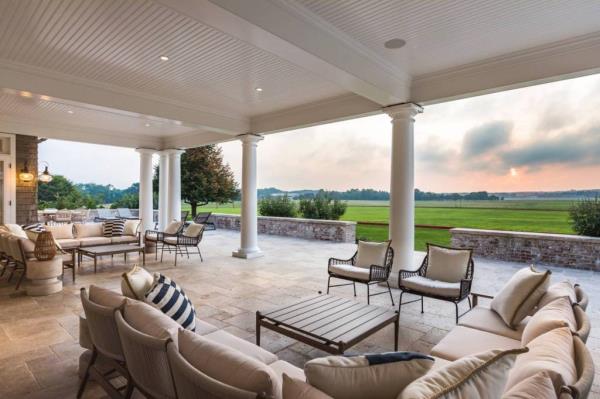 A patio with chairs and tables at 165 Cooks Lane, Water Mill, NY