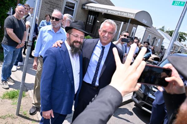 Kennedy taking a photo outside of Hikind's house.