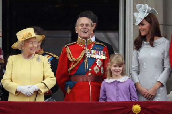 Queen Elizabeth II, Prince Philip, Duchess Catherine, and Lady Louise Windsor standing on Buckingham Palace balcony during Trooping the Colour ceremony