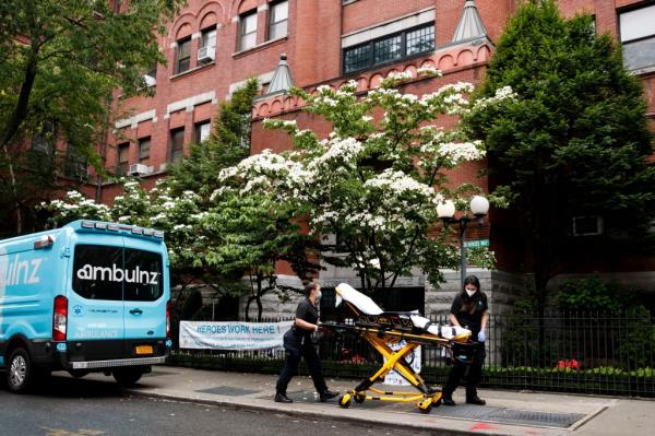 An ambulance and empty gurney arrive at the Cobble Hill Health Center nursing home at 380 Henry St is pictured on June 11, 2020