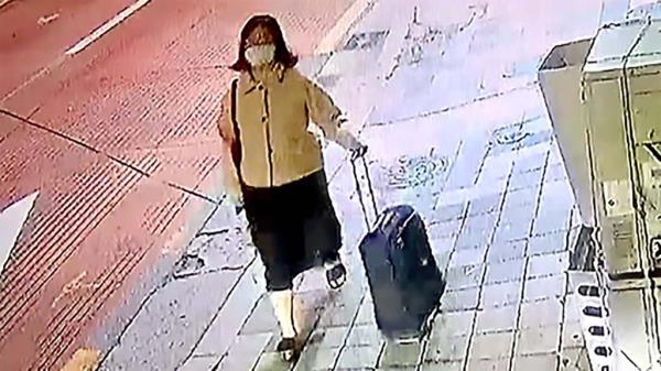 Jung seen with suitcase