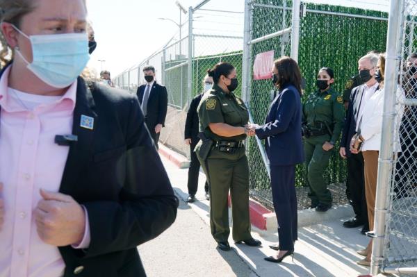 Vice President Kamala Harris at southern border in El Paso, Texas, in June 2021, wher<em></em>e she is seen holding hands with a Border Patrol chief.