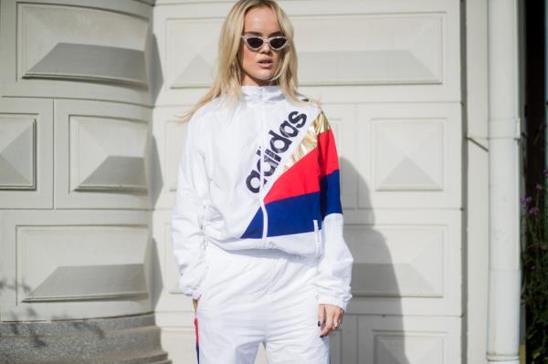 A guest wearing an Adidas track suit outside 