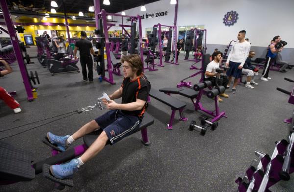 Man working out at planet fitness