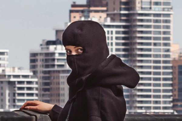 woman working out with ski mask