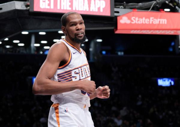 Kevin Durant, who scored a game-high 33 points, reacts during the fourth quarter of the Nets' 136-120 loss to the Suns.