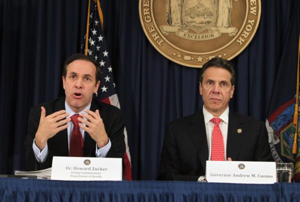 Dr. Howard Zucker acting Commissio<em></em>ner of Health with NY Governor Andrew Cuomo holding a Press co<em></em>nference on the Preparedness of Ebola at his Office at 633 3rd Avenue in Manhattan,NY.