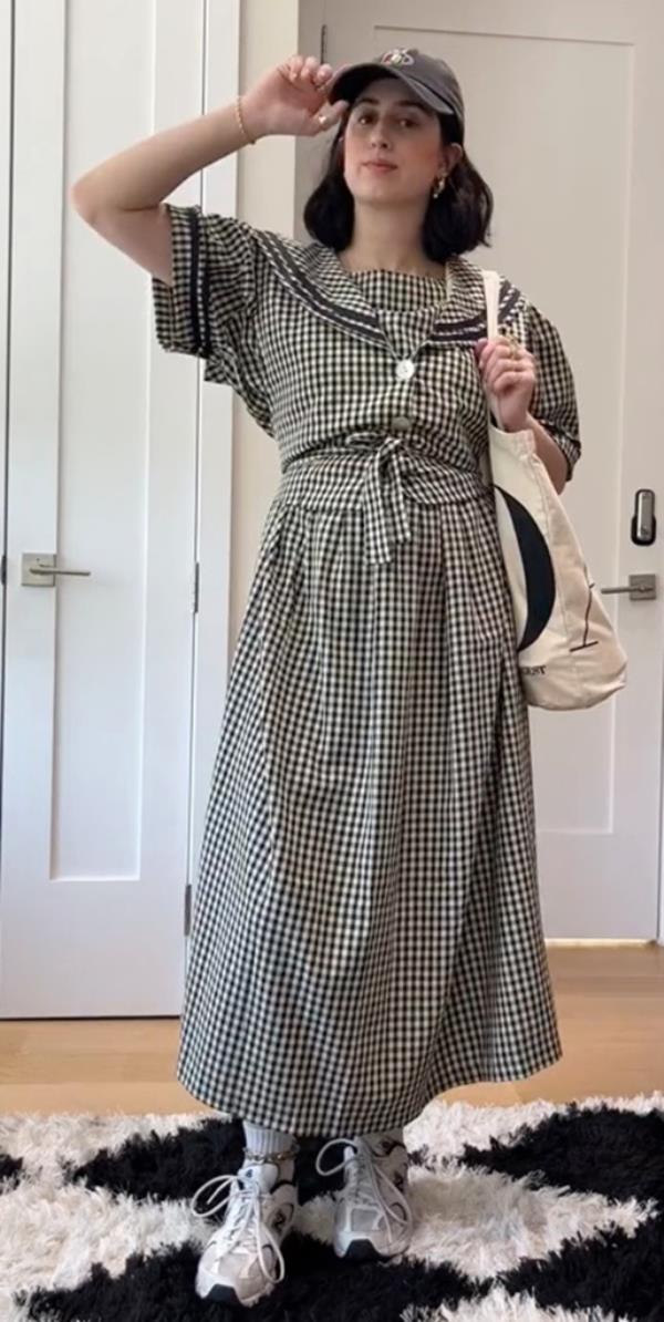 Gingham dress paired with New Balance sneakers