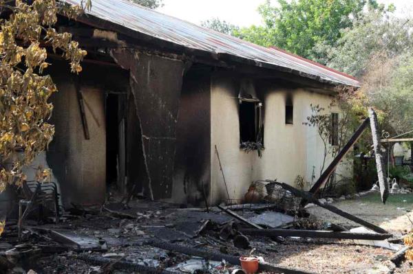 Charred building and items in the Nir Oz kibbutz.