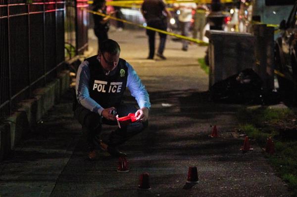 Police investigate the scene of a shooting in the Bronx Mo<em></em>nday night. 