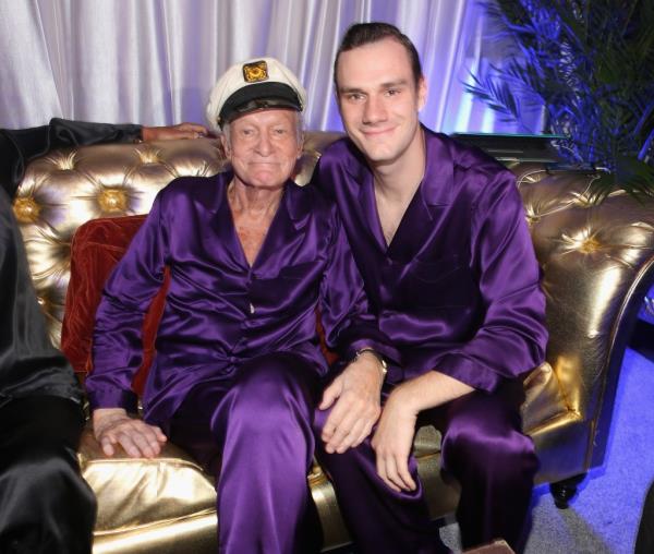 Playboy founder Hugh Hefner with his youngest son, Cooper Hefner, at a party at the Playboy mansion.