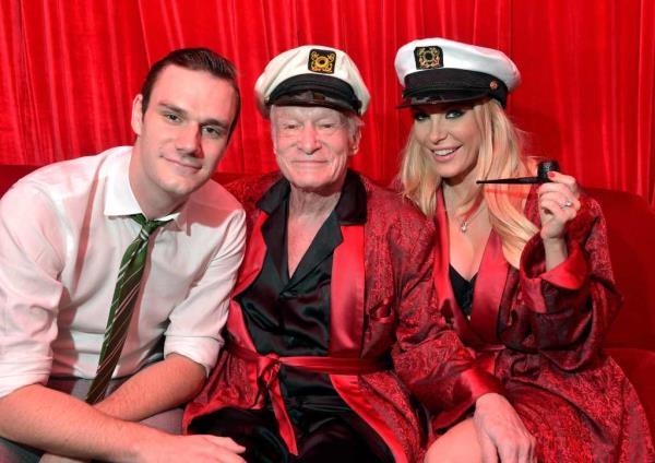 Cooper Hefner, Hugh Hefner and Crystal Hefner, Hugh's third wife, at a party at the Playboy mansion in 2014.