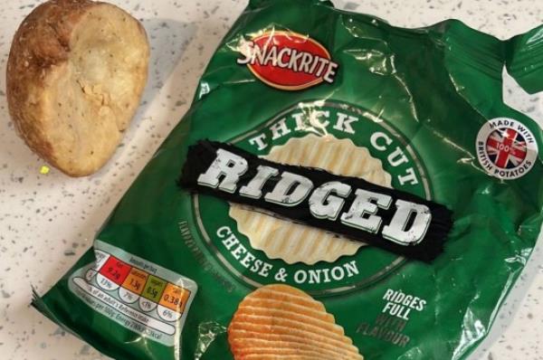 Pictured: The crisp packet which co<em></em>ntained half a potato. A five-year-old and her mother were 'shocked' when they opened a packet of cheese and o<em></em>nion crisps - and found half a potato inside. Alice Upson bought a multipack of Snackrite ? ridged, thick cut cheese and o<em></em>nion crisps ? from Aldi. When five-year-old Mia opened a packet, the infant school pupil was ?confused? to discover a halved potato in there and o<em></em>nly a few crumbs at the bottom of the packaging. Alice, a 34 year old carer, said: ?When Mia opened the packet, she was co<em></em>nfused because she could see something else was in there. SEE OUR COPY FOR DETAILS. ? Daily Echo/Solent News & Photo Agency UK +44 (0) 2380 458800