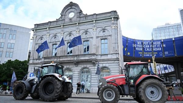 Farmers park their tractors close to the European Parliament during a protest in Brussels against the EU's enviro<em></em>nmental policies