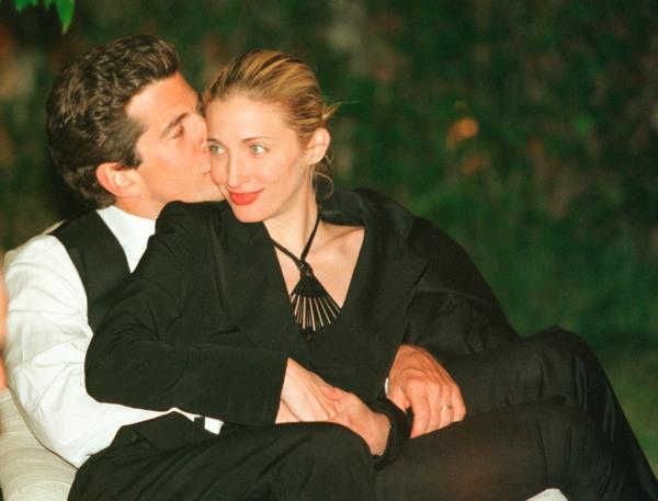 John F. Kennedy Jr. kissing his wife Carolyn Bessette-Kennedy on the cheek at the White House Correspo<em></em>ndents dinner, 1999